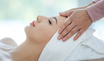 Woman with towel on head having massage