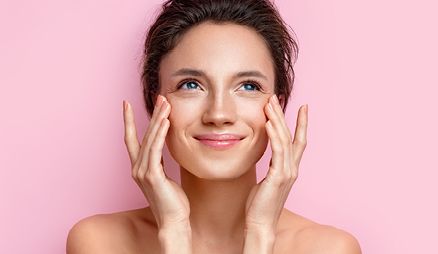 Woman placing her hands on her face
